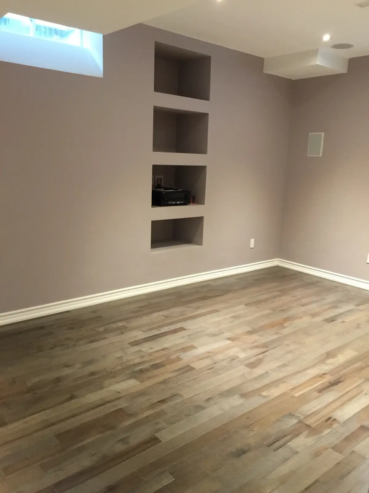Basement room with built-in niches