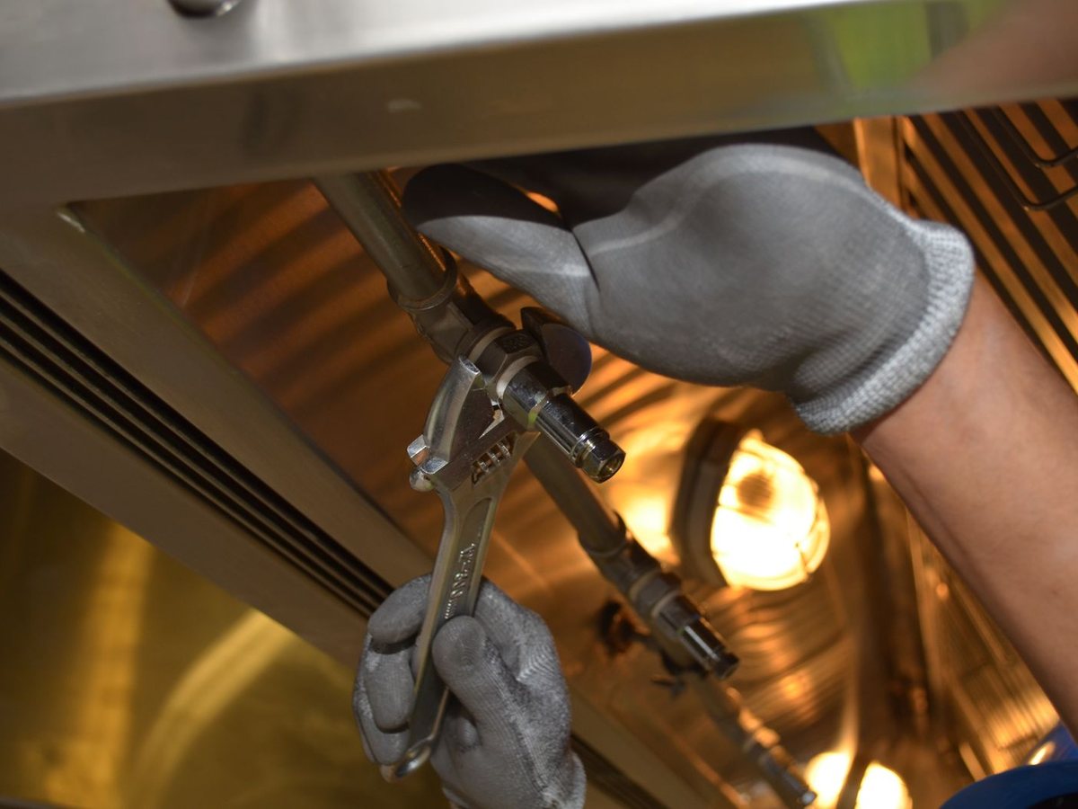 Tightening fittings under the sink — BuildMan Plumbing & Fixtures Toronto